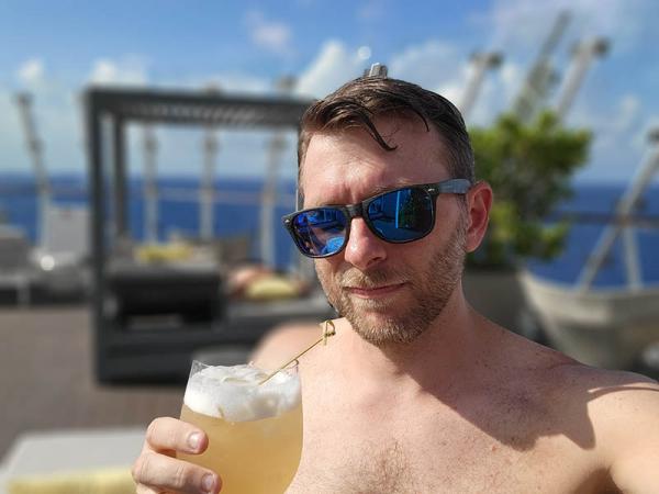 Enjoying a Honeycomb Goldrush Cocktail At the Retreat Sundeck on Celebrity Edge